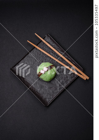 Delicious sweet colorful mochi desserts or ice cream with rice dough and toppings 105335497