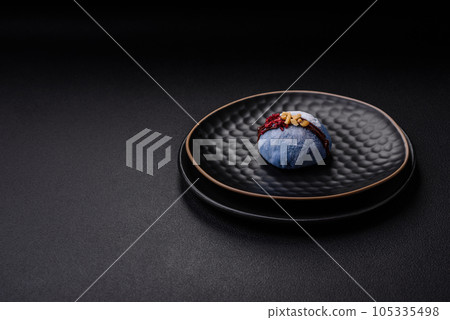 Delicious sweet colorful mochi desserts or ice cream with rice dough and toppings Delicious sweet colorful mochi desserts or ice cream with rice dough and toppings 105335498