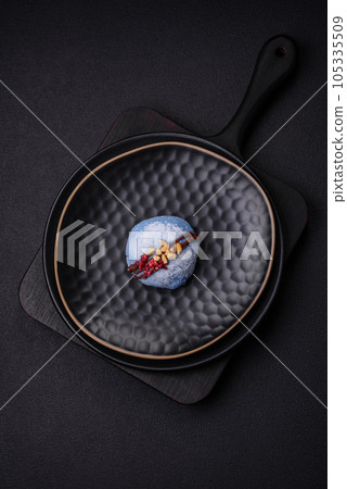 Delicious sweet colorful mochi desserts or ice cream with rice dough and toppings Delicious sweet colorful mochi desserts or ice cream with rice dough and toppings 105335509