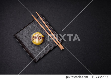 Delicious sweet colorful mochi desserts or ice cream with rice dough and toppings 105335554