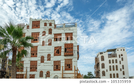 Al-Balad old town with traditional muslim houses with wooden windows and balconies, Jeddah, Saudi Arabia Al-Balad old town with traditional muslim houses with wooden windows and balconies, Jeddah, Saudi Arabia 105335959