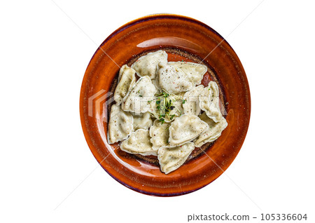 Polish Pierogi Dumplings with potato in a plate with herbs and butter. High quality Isolate, white background. 105336604