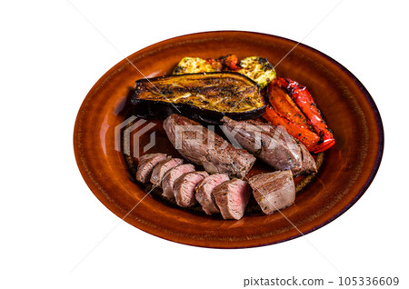 Grilled mutton tenderloin Fillet Meat, lamb sirloin on rustic plate with vegetables. High quality Isolate, white background. Grilled mutton tenderloin Fillet Meat, lamb sirloin on rustic plate with vegetables. High quality Isolate, white background. 105336609