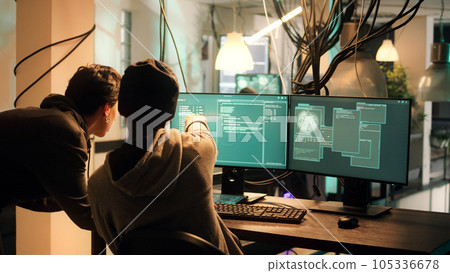 Male hacker using knowledge of computer science to access important data illegally, breaking into network system or server. Thief doing cryptojacking and espionage with virus. 105336678