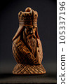 Roughly carved wood figurine of a chess king 105337196