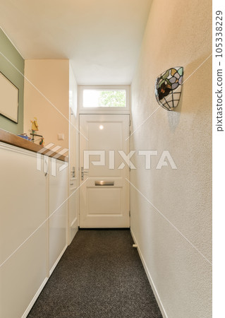 an empty room with a white door and some cupboards on the wall next to the entrance way in this house an empty room with a white door and some cupboards on the wall next to the entrance way in this house 105338229