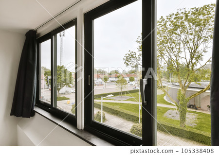 a view out the window from inside an apartment building in berlin, germany on a cloudy day with no clouds a view out the window from inside an apartment building in berlin, germany on a cloudy day with no clouds 105338408