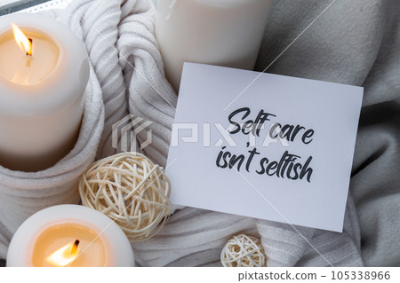 SELF CARE ISNT SELFISH text saying phrase on paper note on background of Home fragnance concept autumn holidays at cozy home. Still life of micro moment candid slow living. Mental health wellbeing SELF CARE ISNT SELFISH text saying phrase on paper note on background of Home fragnance concept autumn holidays at cozy home. Still life of micro moment candid slow living. Mental health wellbeing 105338966