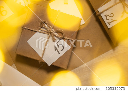 Original Advent Calendar for Christmas Homemade. Preparation to Christmas concept. Family winter holidays. Eco friendly presents gifts. open the package every day Original Advent Calendar for Christmas Homemade. Preparation to Christmas concept. Family winter holidays. Eco friendly presents gifts. open the package every day 105339073