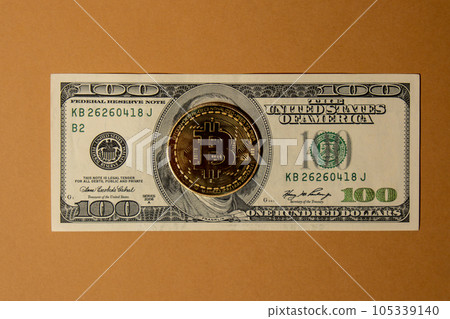 Bitcoin gold coin on bills of 100 dollars American currency. Bitcoin mining trading concept. BTC golden money spinning around. Worldwide virtual internet Cryptocurrency or crypto digital payment Bitcoin gold coin on bills of 100 dollars American currency. Bitcoin mining trading concept. BTC golden money spinning around. Worldwide virtual internet Cryptocurrency or crypto digital payment 105339140