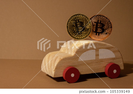 Bitcoin gold coin with wooden toy car. Saving and manage money for transport car loan mining trading concept. Automotive transportation industry merge with technology exchange financial market can pay Bitcoin gold coin with wooden toy car. Saving and manage money for transport car loan mining trading concept. Automotive transportation industry merge with technology exchange financial market can pay 105339149