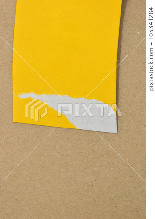 yellow curve paper put on brown background 105341284