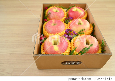 beautiful pink apple in the box on wood floor, healthy fruit beautiful pink apple in the box on wood floor, healthy fruit 105341317