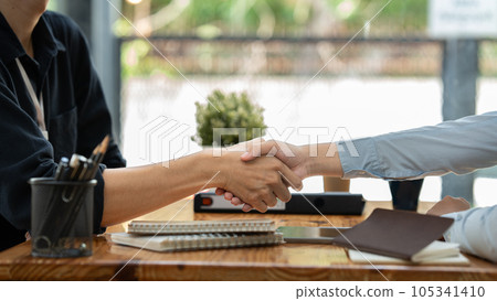 Business man and woman handshaking partner business handshake agreement cooperation Business man and woman handshaking partner business handshake agreement cooperation 105341410