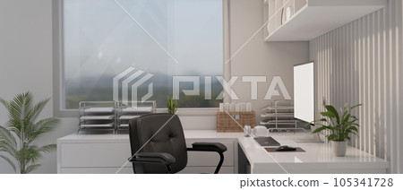 A modern white office room with a computer mockup on a white corner table against the window 105341728