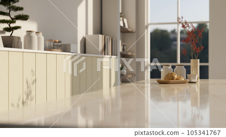 Empty space on a luxury white marble kitchen tabletop in a modern bright kitchen. 105341767