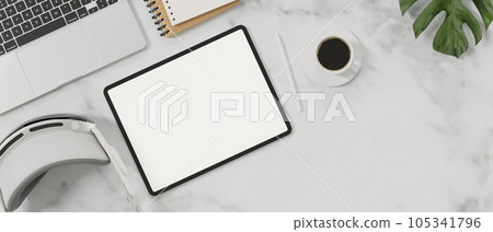 Top view of minimal workspace with blank screen mock up tablet, coffee cup, vr glasses. Top view of minimal workspace with blank screen mock up tablet, coffee cup, vr glasses. 105341796