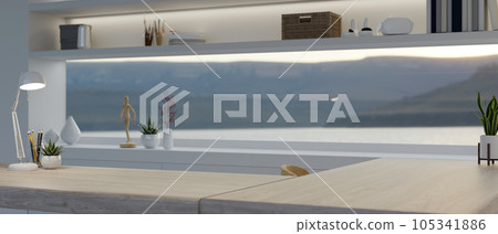 Copy space on a wooden tabletop in a modern home office with a long window and decor. Copy space on a wooden tabletop in a modern home office with a long window and decor. 105341886