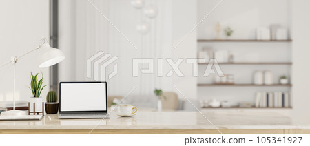 Workspace with laptop mockup on a white marble tabletop in luxury white living room. 105341927