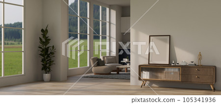 A minimal hallway through the living room with a blank frame mockup on a wooden cabinet A minimal hallway through the living room with a blank frame mockup on a wooden cabinet 105341936