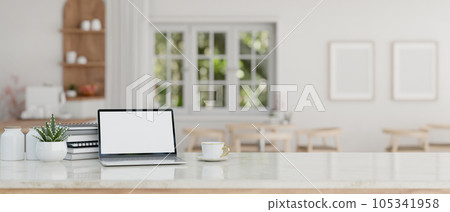 Workspace with laptop white screen mockup on a tabletop in a minimal white cafe. 105341958