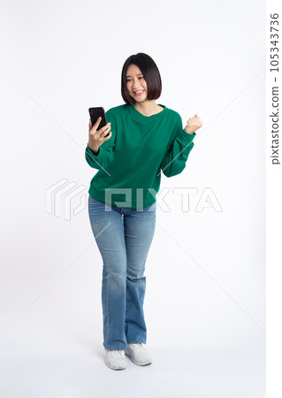 portrait asian young Women are happy while using smartphone isolated on white background portrait asian young Women are happy while using smartphone isolated on white background 105343736