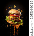 A burger, piled high with juicy beef, melted cheese, crisp lettuce, and tangy pickles. 105344019