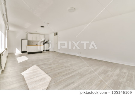 an empty living room with wood floors and white walls in the room is very clean, but there is no furniture an empty living room with wood floors and white walls in the room is very clean, but there is no furniture 105346109