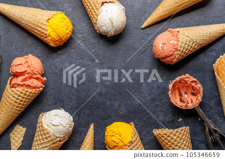 Assorted ice cream flavours in a delightful waffle cones Assorted ice cream flavours in a delightful waffle cones 105346659
