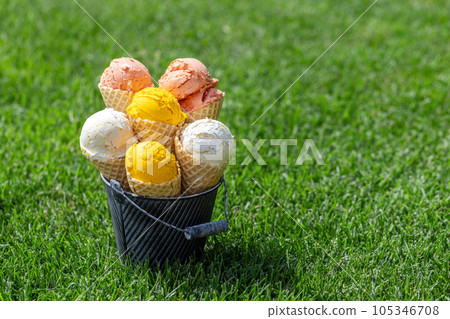 Assorted ice cream flavours in delightful waffle cones 105346708