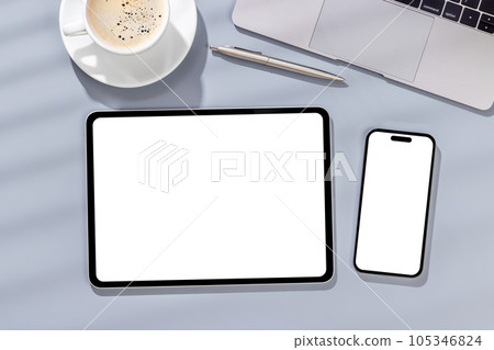 Blank screen smartphone and tablet on a desk Blank screen smartphone and tablet on a desk 105346824