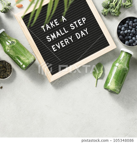 Take a small step every day letter board quote flat lay 105348086