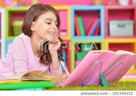 schoolgirl doing homework 105348352