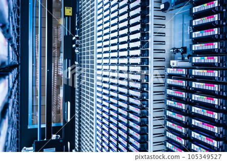 tall stacks of data backup tapes in internet cloud center 105349527