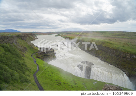 Gullfoss waterfall in summer season in Iceland. Famous nature landscape background Gullfoss waterfall in summer season in Iceland. Famous nature landscape background 105349669