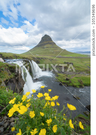 Kirkjufell mountain and river in Iceland in summer season. Famous landscape nature background at sunset 105349696