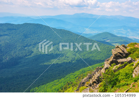 carpathian watershed ridge. stones and boulders on the green grassy hills. hot summer day. location pikui mountain, ukraine carpathian watershed ridge. stones and boulders on the green grassy hills. hot summer day. location pikui mountain, ukraine 105354999