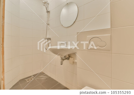 a bathroom with a sink, mirror and toilet paper dispensed on the wall next to the shower a bathroom with a sink, mirror and toilet paper dispensed on the wall next to the shower 105355293