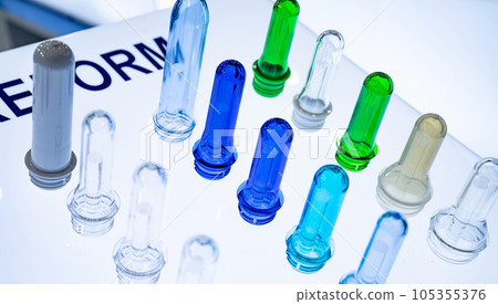 PET plastic bottle preforms before blow molding. Packaging industry. PET preforms from preforms injection molding machine. Raw material for PET bottle. Recycle plastic. Polyethylene terephthalate. 105355376