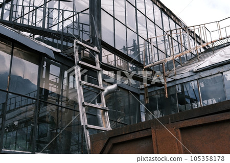 Glass roof and wall of the greenhouse in the National Botanical Garden in Kiev, Ukraine. 105358178