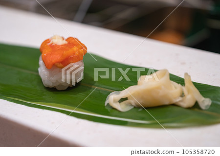 Japanese nigiri sushi. Fresh red sea squirts and gari. Japanese nigiri sushi. Fresh red sea squirts and gari. 105358720