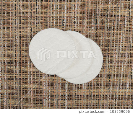 Cotton Disks, Hygiene Pads on Eco Linen Background, Round Facial Sponge, Soft Clear Disk Stack 105359096
