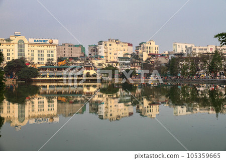 Hoan Kiem lake, Ho Guom, Sword lake with Hanoi cityscape. Hoan Kiem is center of Hanoi city, Vietnam Hoan Kiem lake, Ho Guom, Sword lake with Hanoi cityscape. Hoan Kiem is center of Hanoi city, Vietnam 105359665