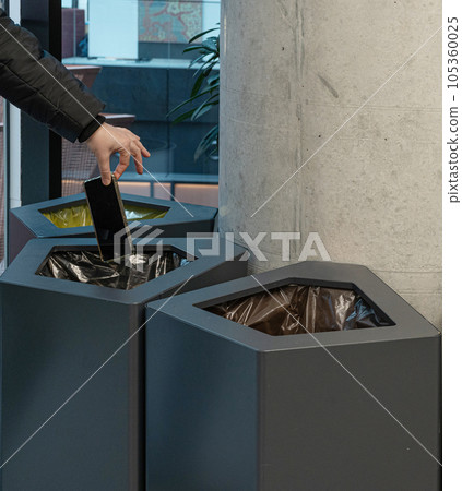 Throwing Out Smartphone, Put Electronic Device Into Trash Can, Throwed Away Smartphone 105360025