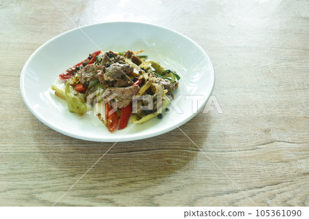 spicy stir fried ostrich meat with onion and black pepper on plate spicy stir fried ostrich meat with onion and black pepper on plate 105361090