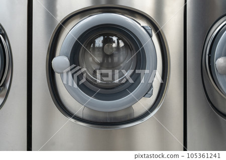 Laundromat Service, Line of Laundry Machines, Commercial Laundrette, Public Launderette Washer 105361241