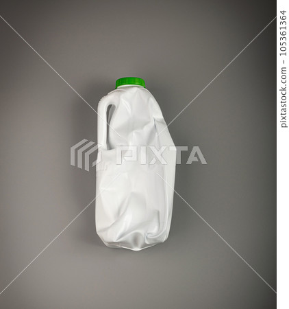Empty Plastic Milk Bottle, Crumpled White Plastic Bottle, Global Pollution Concept, Squashed Pet Bottles Empty Plastic Milk Bottle, Crumpled White Plastic Bottle, Global Pollution Concept, Squashed Pet Bottles 105361364