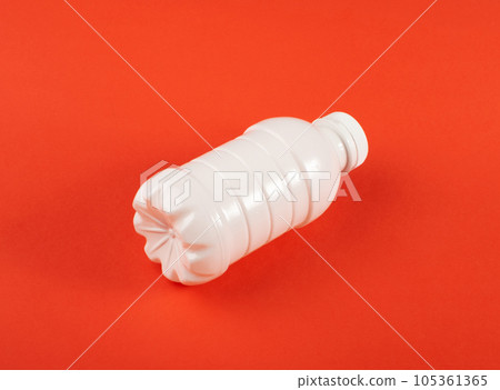 Empty Plastic Milk Bottle, White Plastic Bottle, Global Pollution Concept, Squashed Pet Bottles Empty Plastic Milk Bottle, White Plastic Bottle, Global Pollution Concept, Squashed Pet Bottles 105361365
