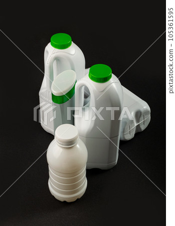 Empty Plastic Milk Bottle, Crumpled White Plastic Bottle, Global Pollution Concept, Squashed Pet Bottles Empty Plastic Milk Bottle, Crumpled White Plastic Bottle, Global Pollution Concept, Squashed Pet Bottles 105361595