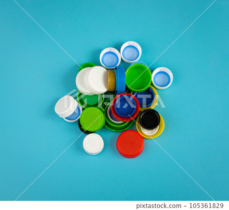 Plastic Bottle Caps Pile. Recycling HDPE Material Group, Circle Polyethylene Lid Set, Colorful Caps Group Plastic Bottle Caps Pile. Recycling HDPE Material Group, Circle Polyethylene Lid Set, Colorful Caps Group 105361829